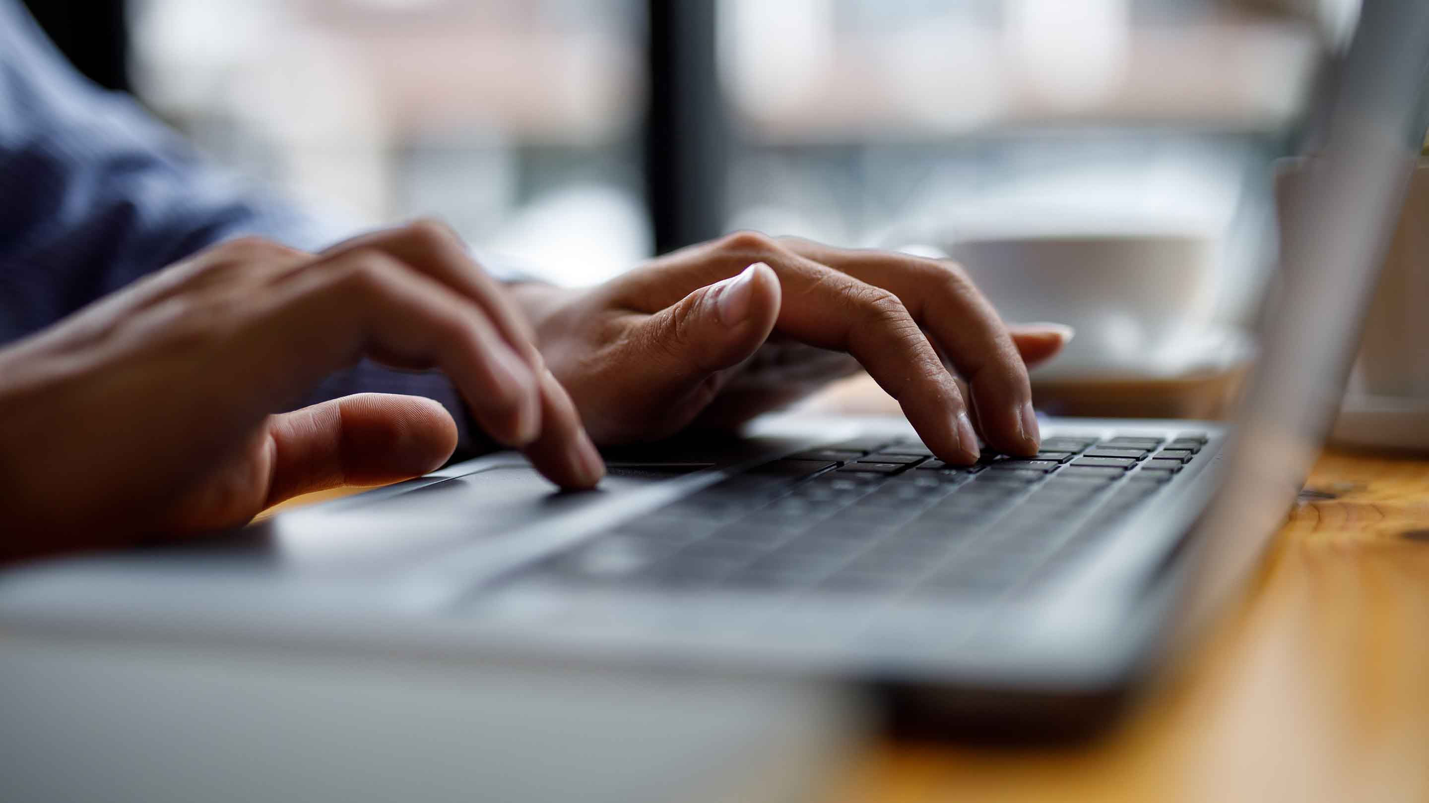 Typing on a keyboard.