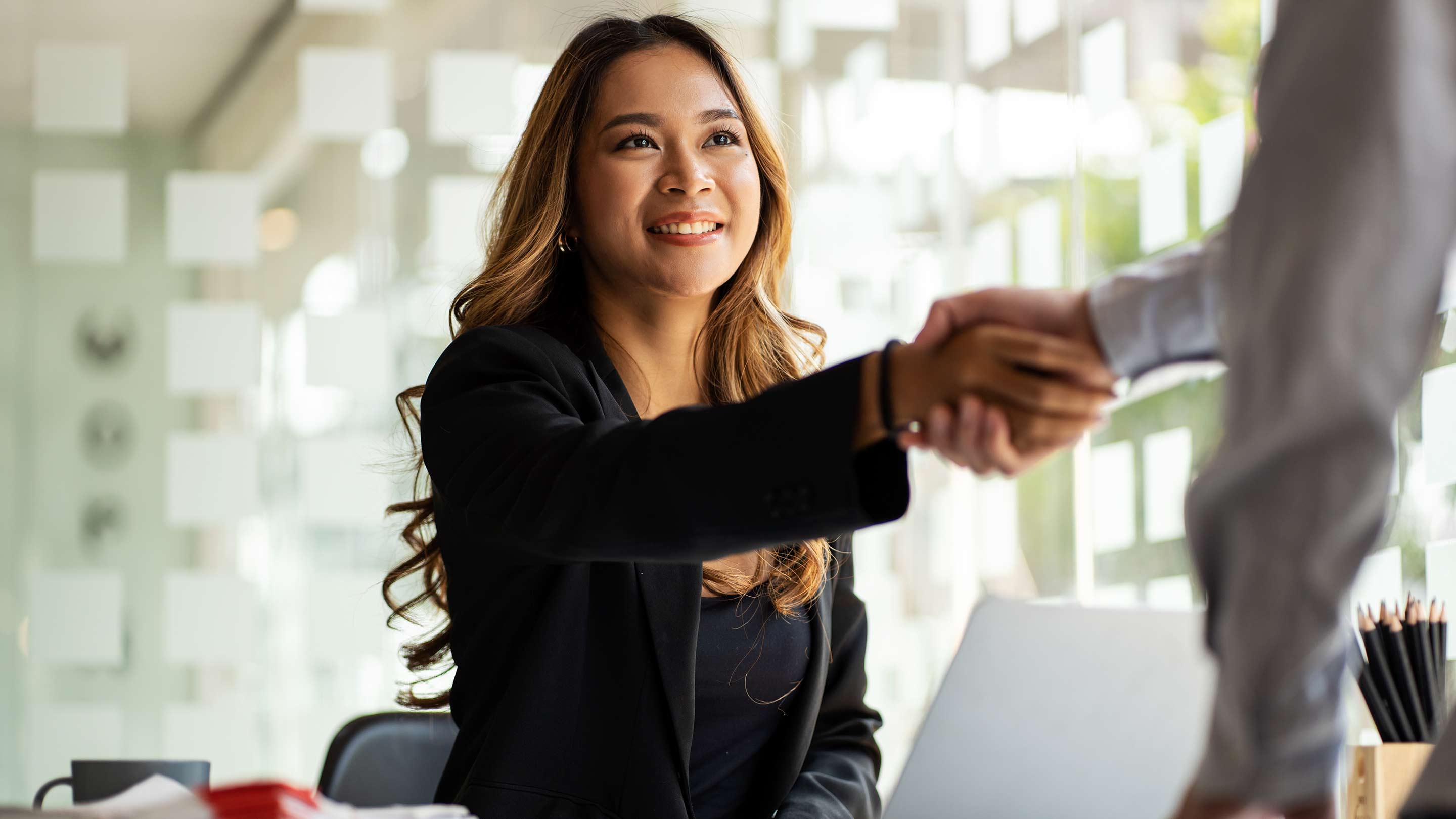 Shaking hands during a job interview.