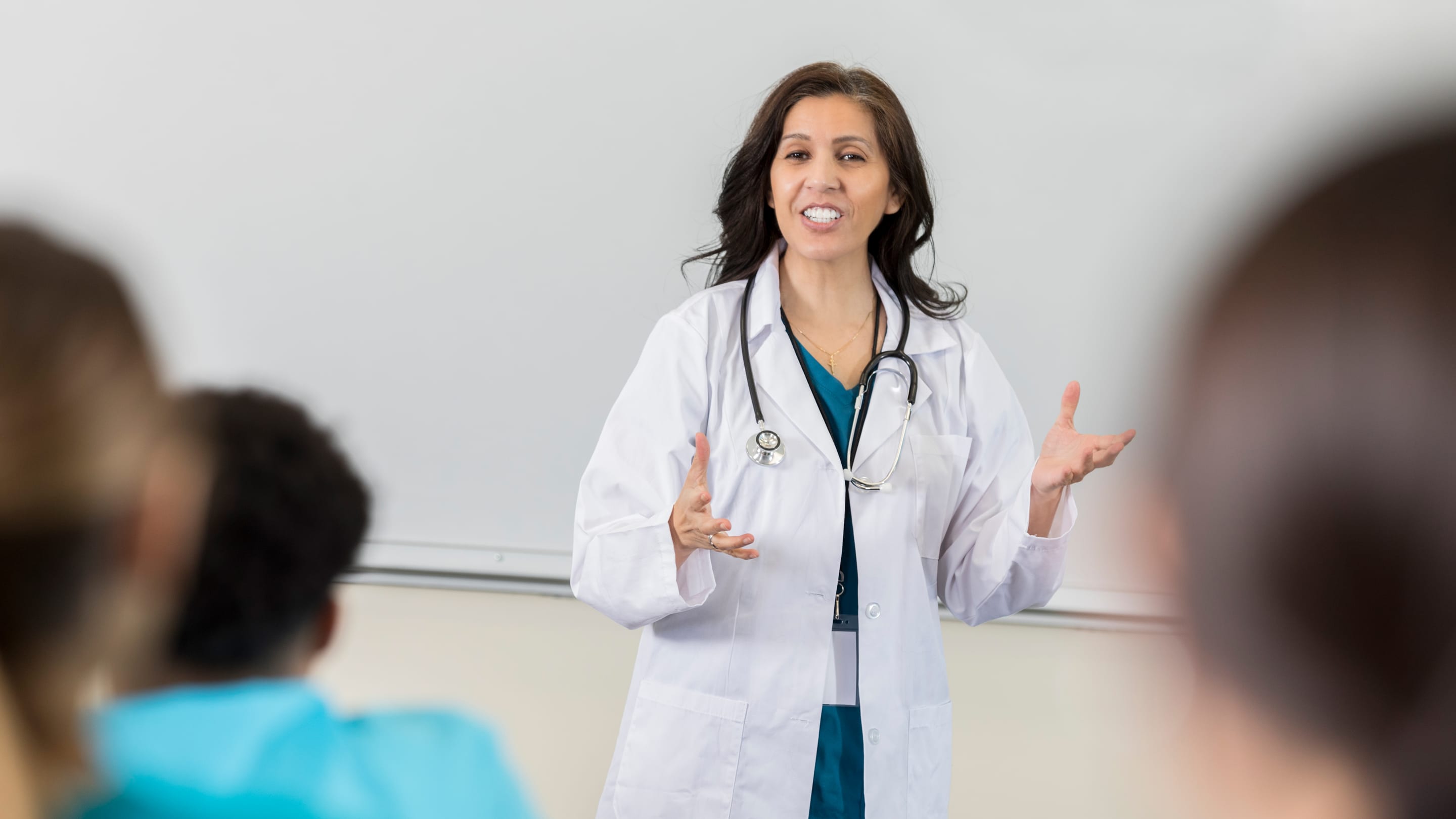 Image of a physician teaching  a medical school class