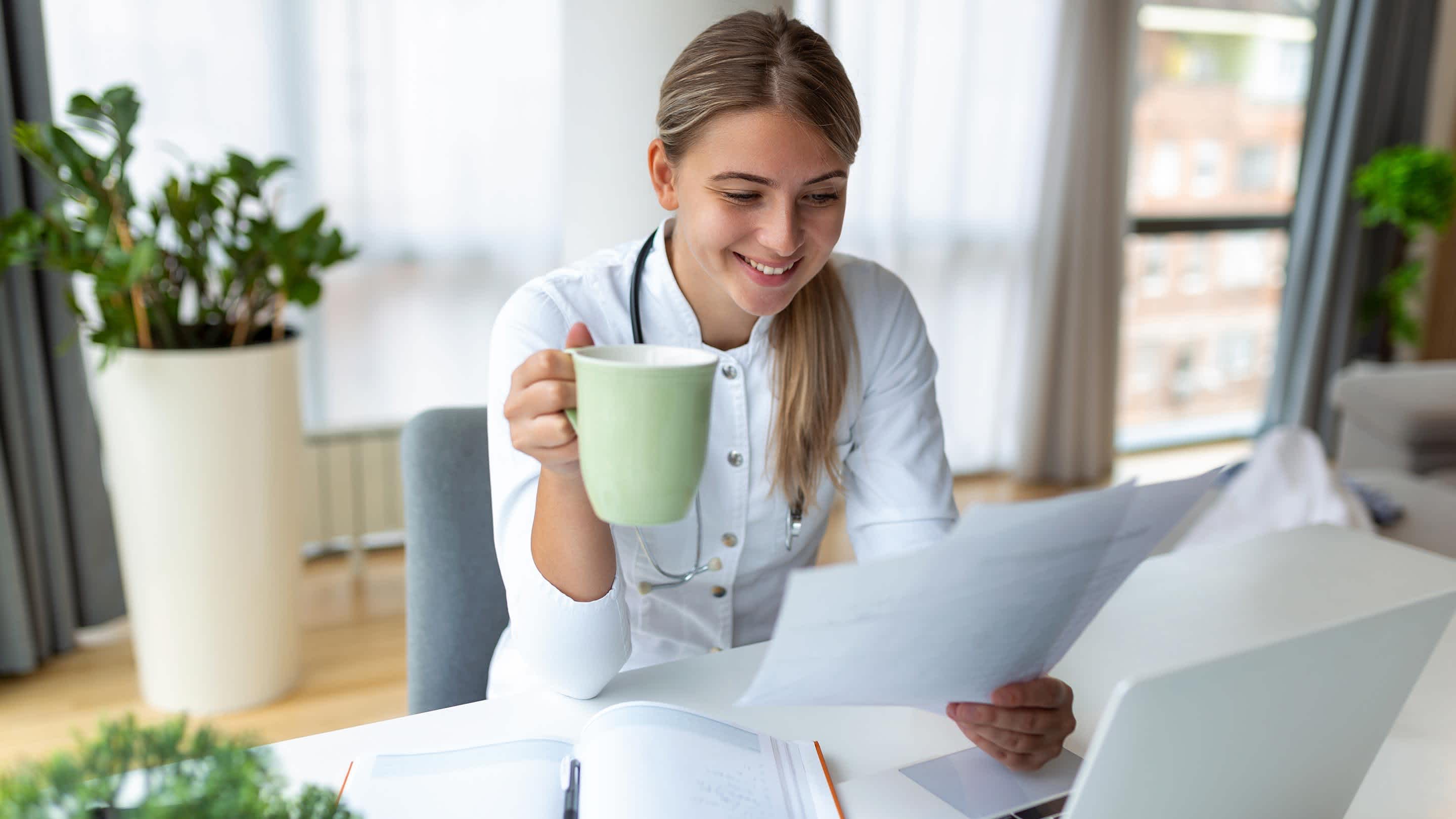 Young woman studying for Board Exam on her computer.
