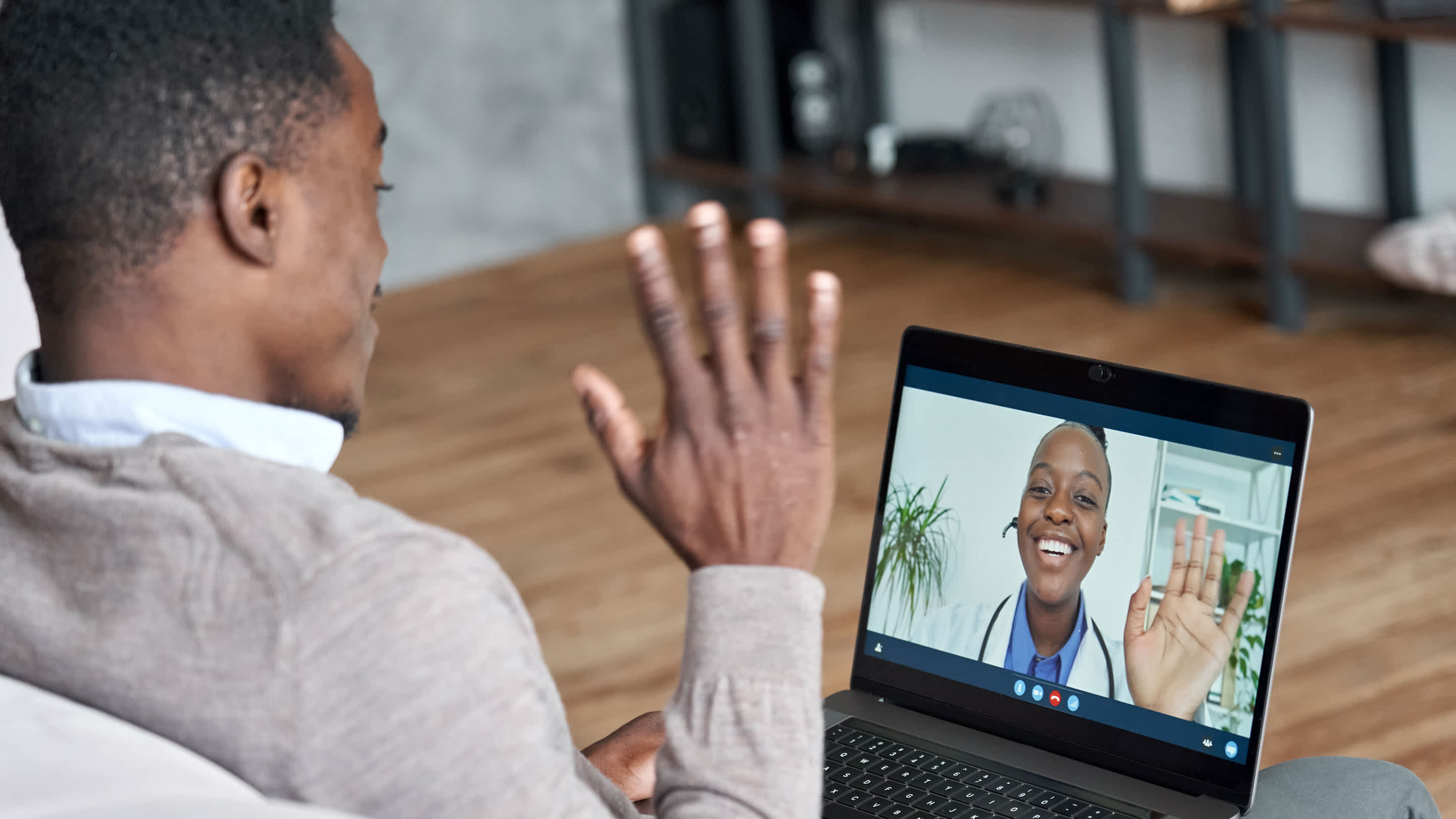 Patient talking in a telehealth appointment with a physician.