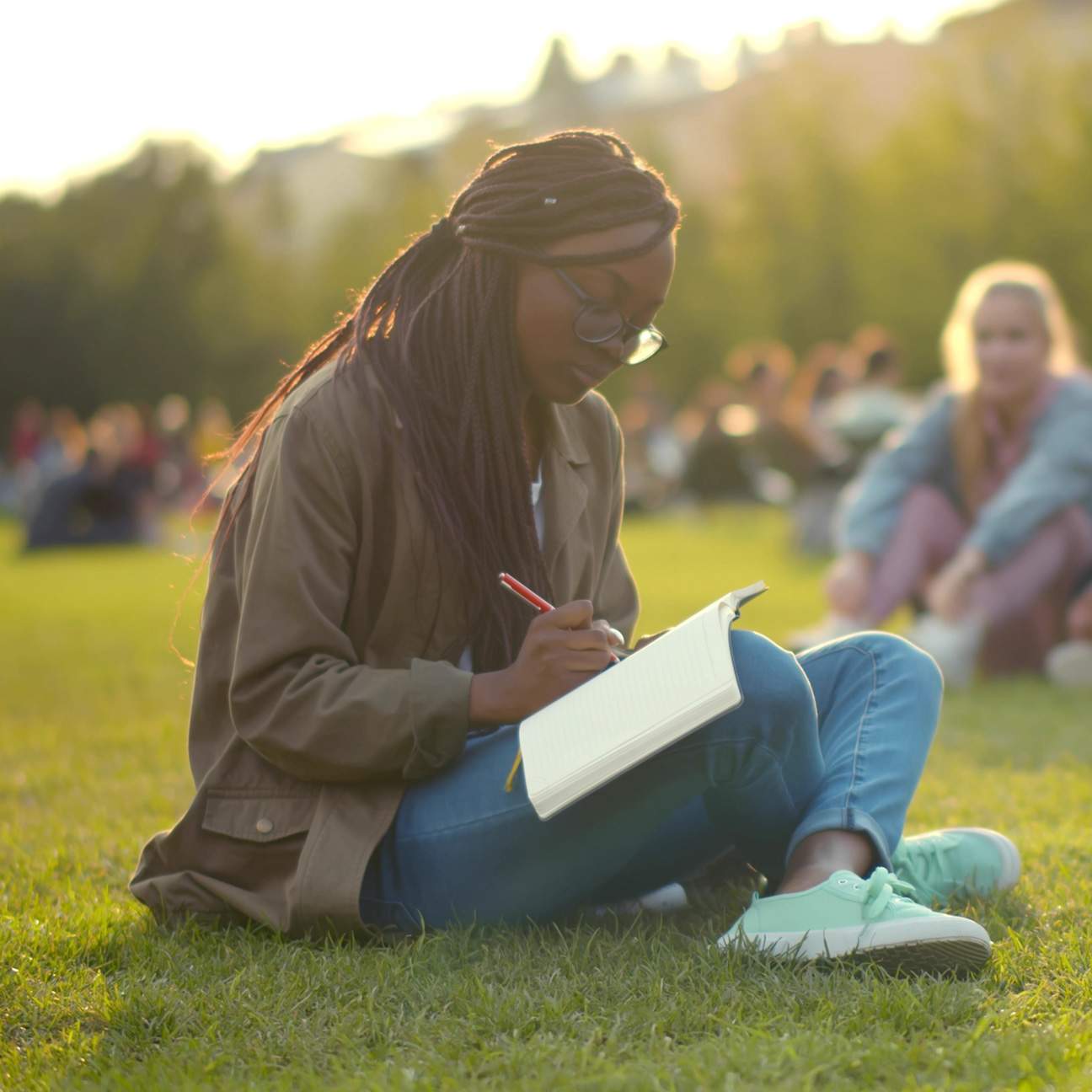 Student doing homework in a park