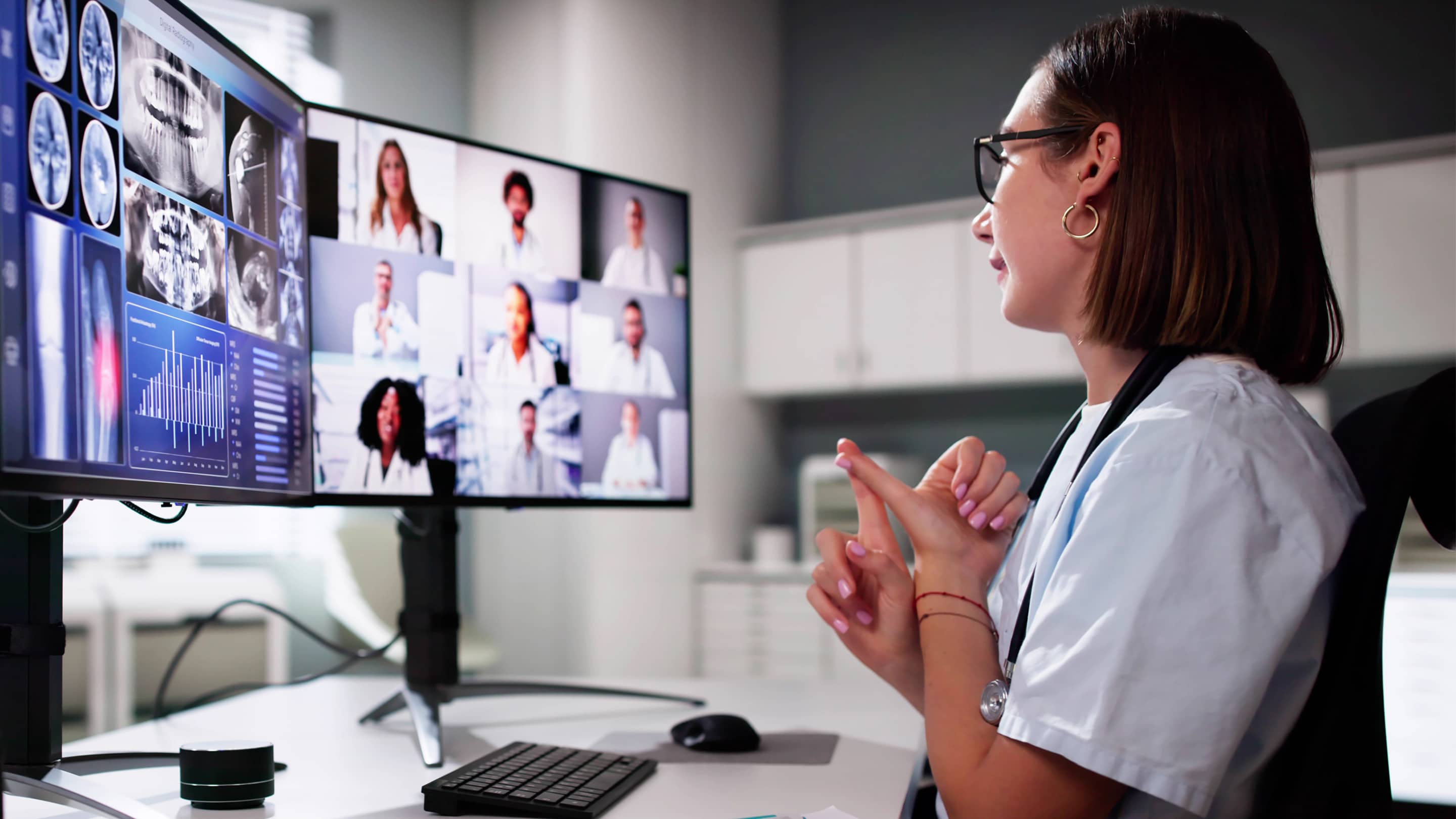 Physician completing CME course on computer.
