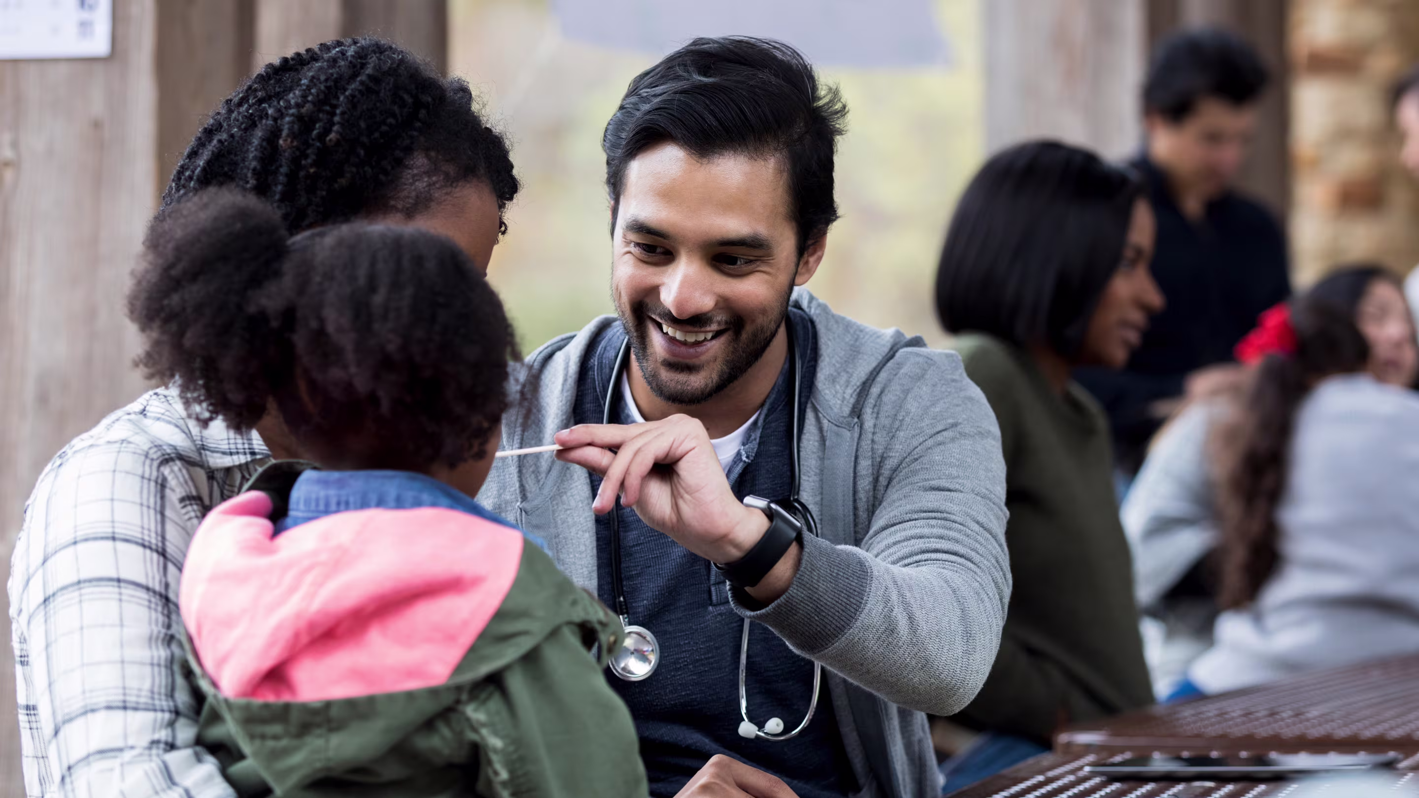 Physicians volunteering at a community health event.