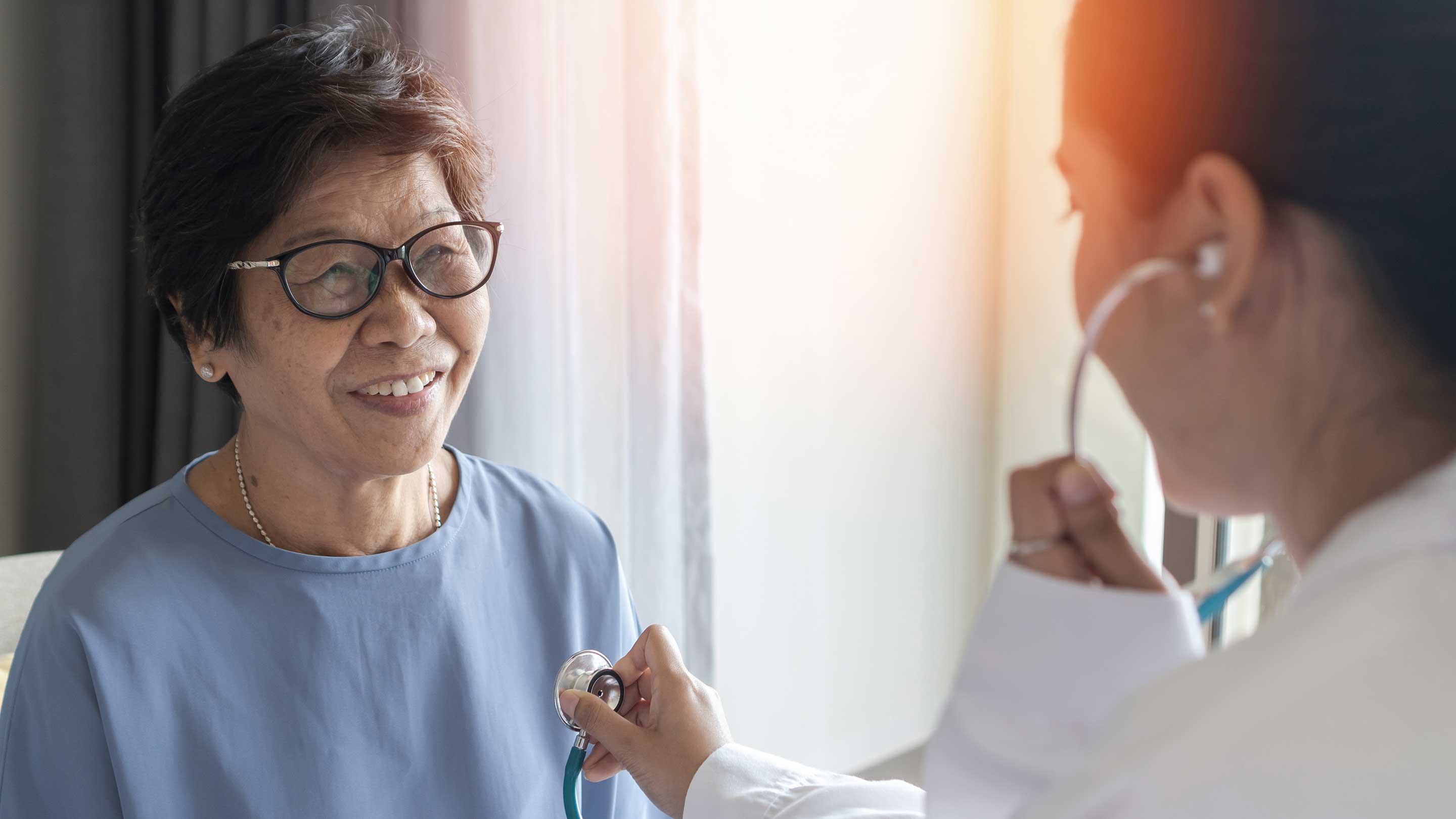 Physician with older female patient