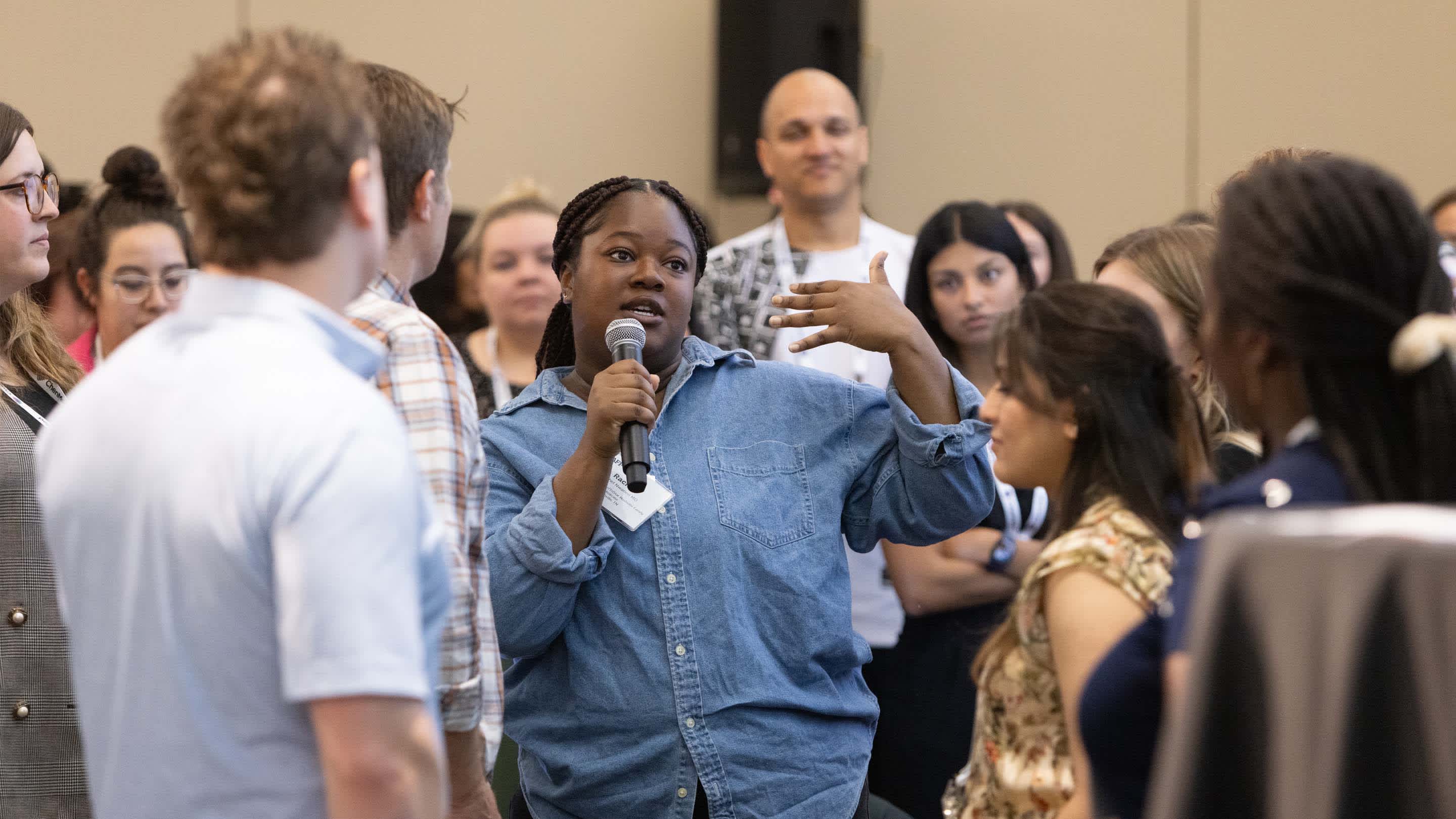African American Woman asks a question in open forum at CHIEFS