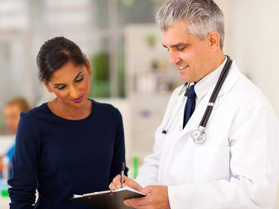 physician consulting with female patient
