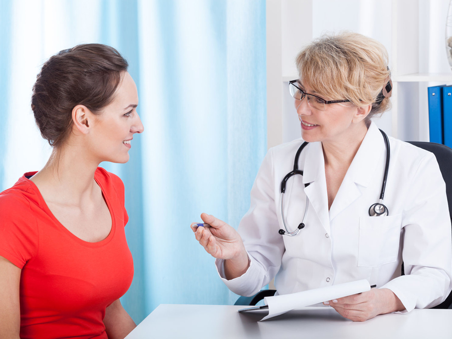 Woman speaking with her physician