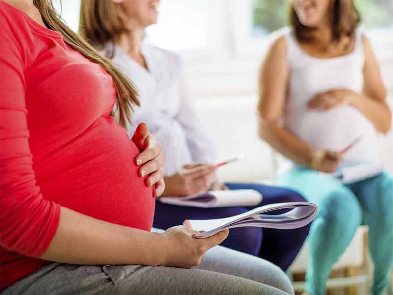 pregnant women in clinic waiting room