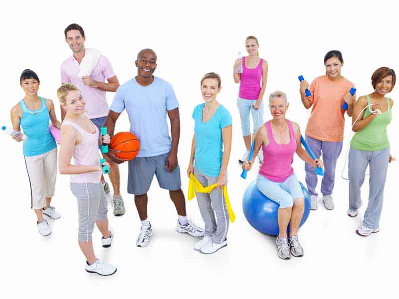 group of people with various pieces of exercise equipment