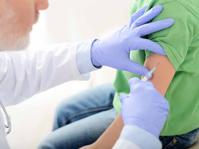 young child receiving vaccination