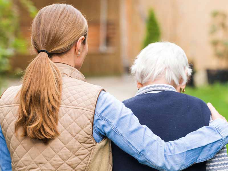 Woman caring for older family member