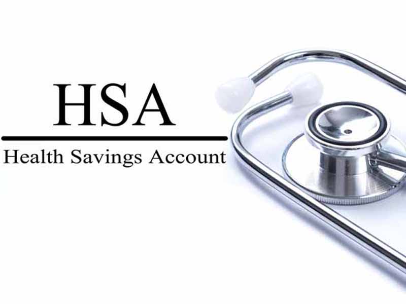 Page with HSA (Health Savings Account) on the table with stethoscope, medical concept