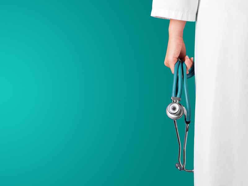 physician holding stethoscope