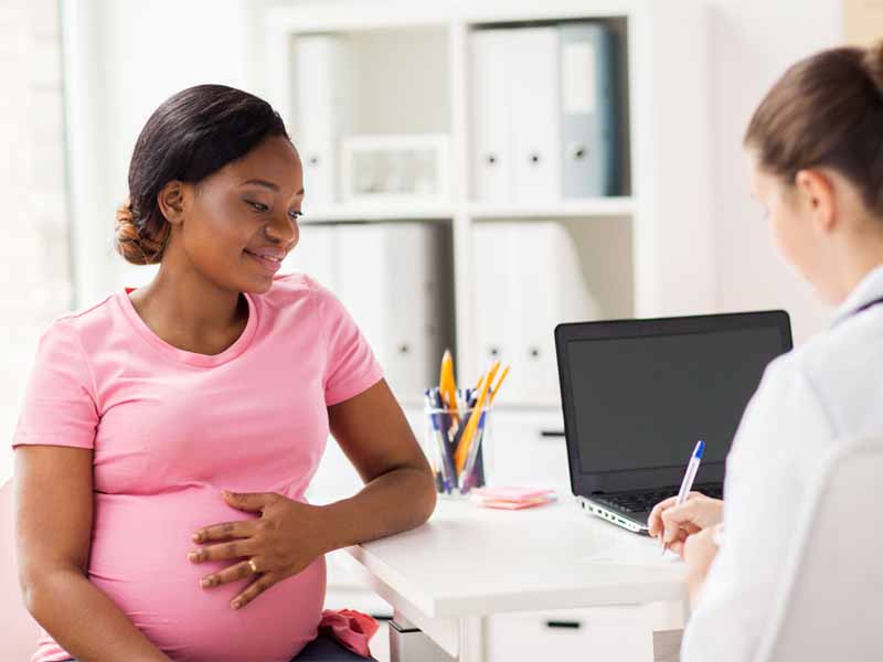 clinician counseling pregnant woman