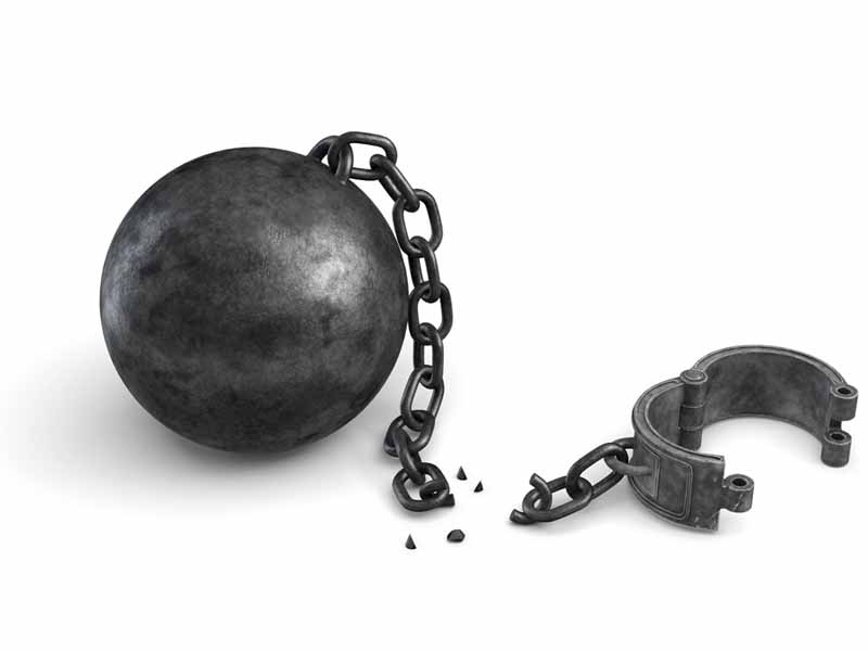 3d rendering of an isolated ball and chain lying broken near a leg shackle. Business boundaries. Freedom and rights. Legal help.