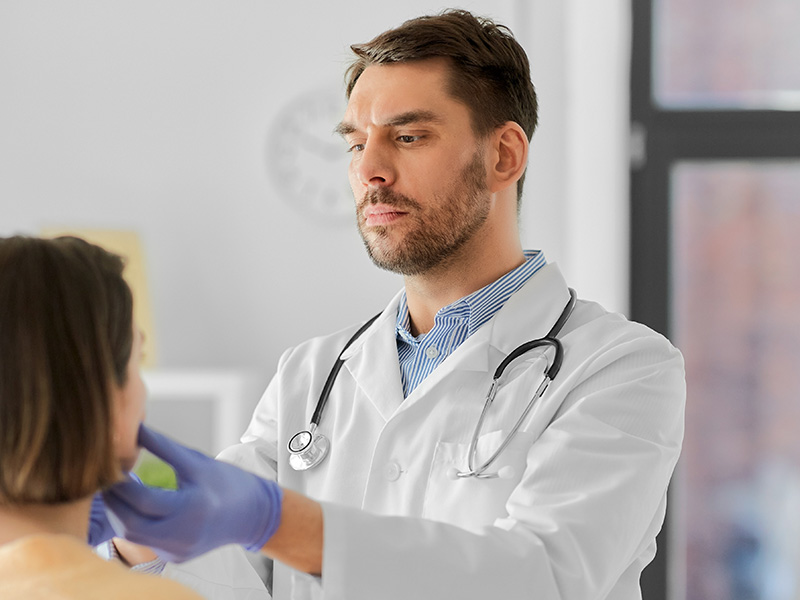 a male examines a female patient