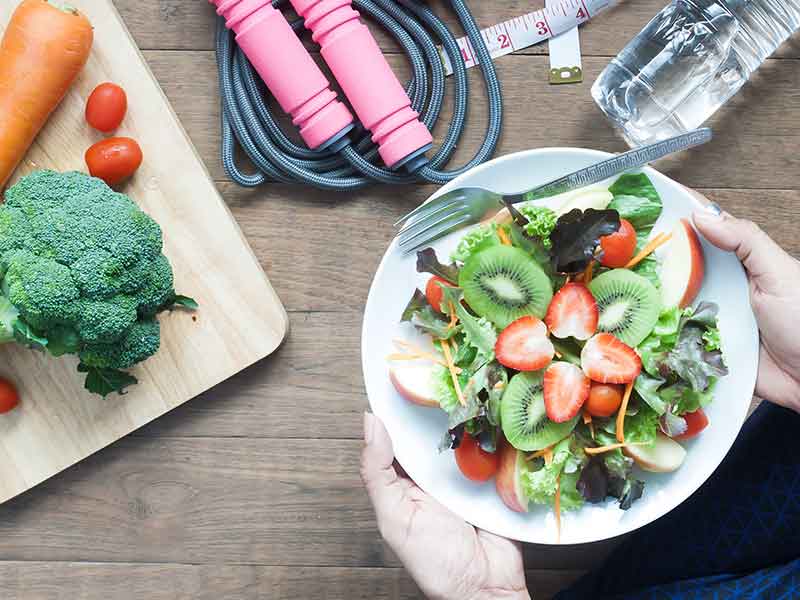 a healthy meal with a jump rope and water bottle