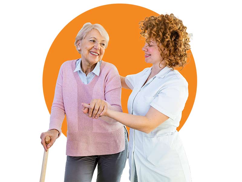 a female caregiver helps a female older adult walk