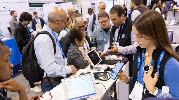 Attendees gathered around booths in the Expo Hall