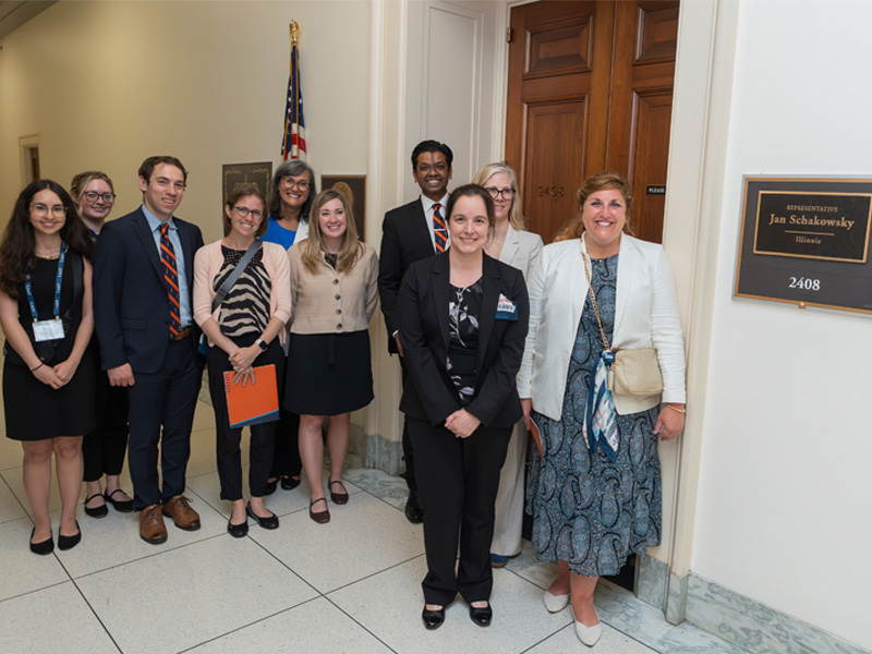 A group from the FMAS conference poses outside the office of Representative Jan Schakowsky in Washington, D.C.
