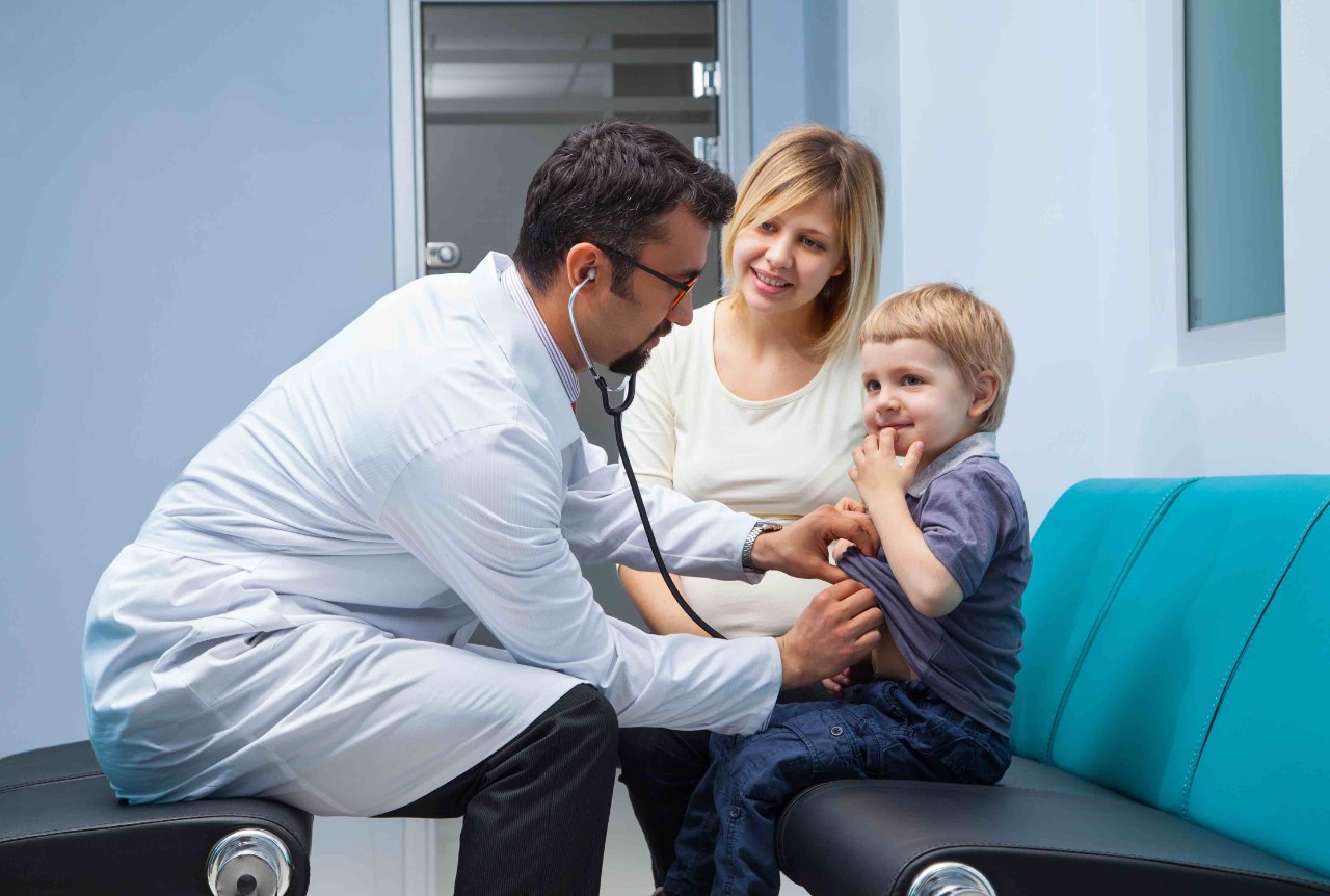 Physician treating child