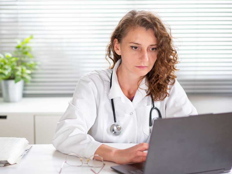 Doctor on laptop