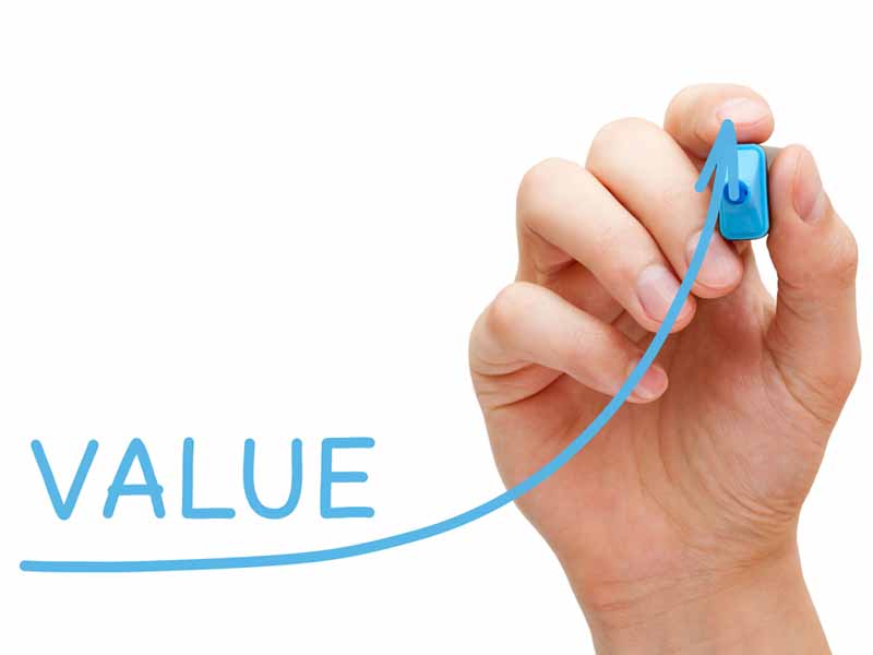 value with hand and blue marker