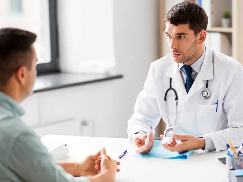 physician discussing diabetes care with patient