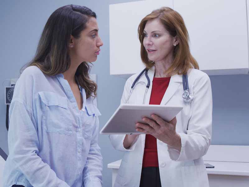 female physician and patient talking