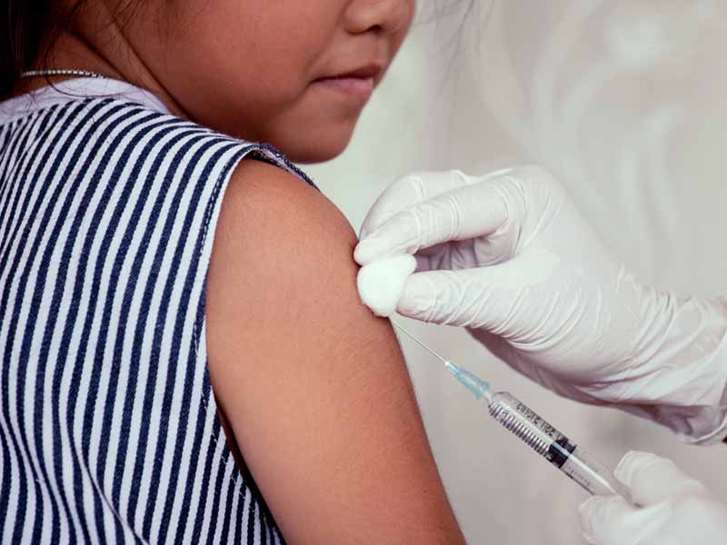 young child receiving vaccination