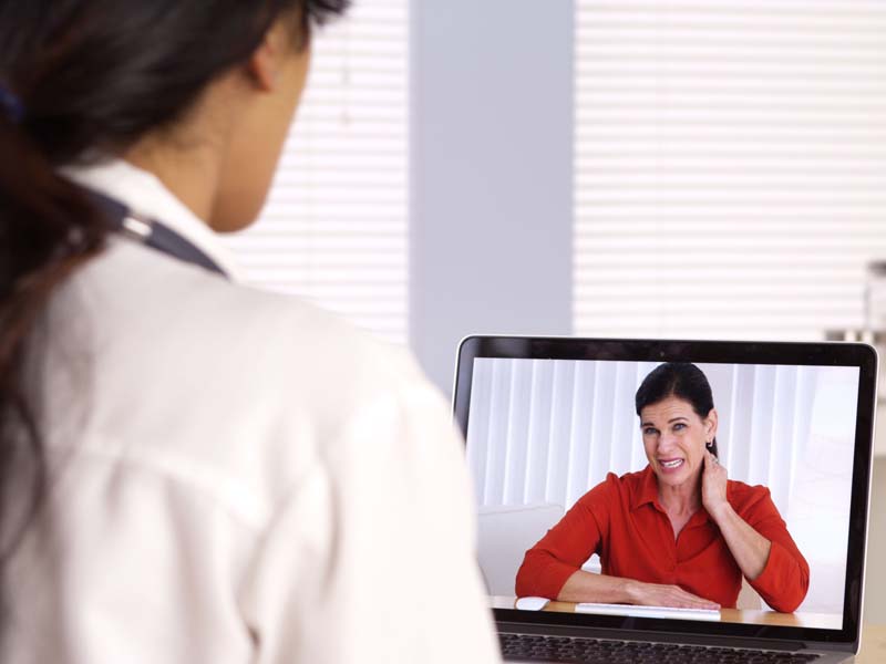 physician having teleconference with patient