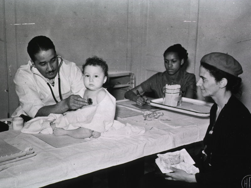 physician examining infant