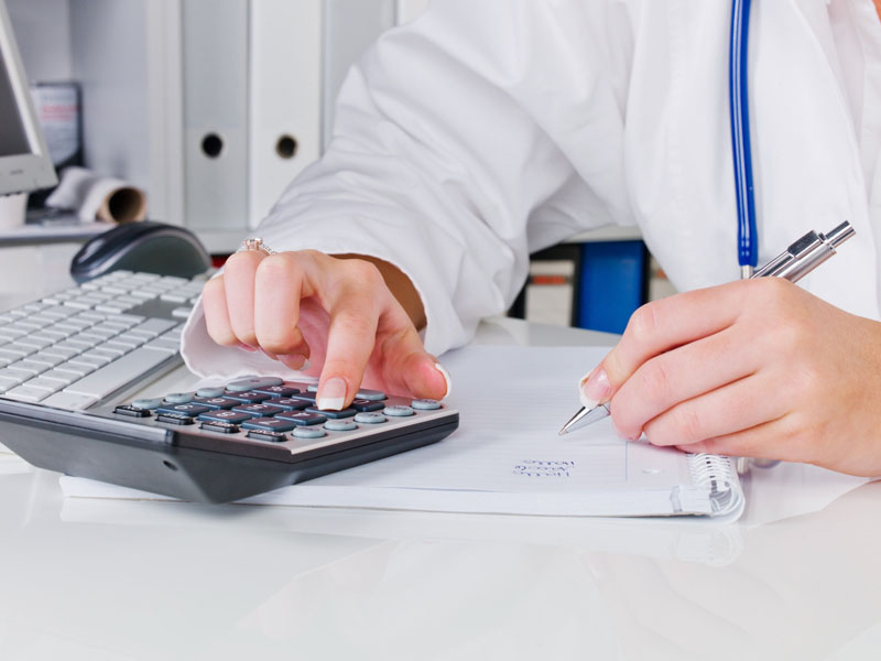 physician with calculator