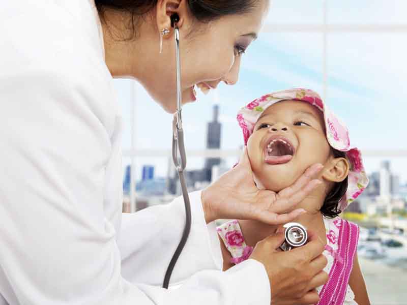Physician examining young patient