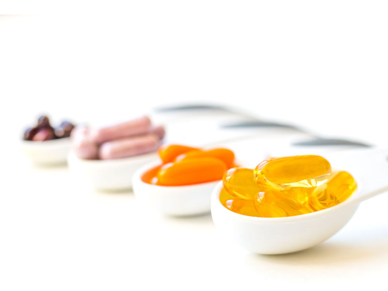 supplements and vitamins in spoons