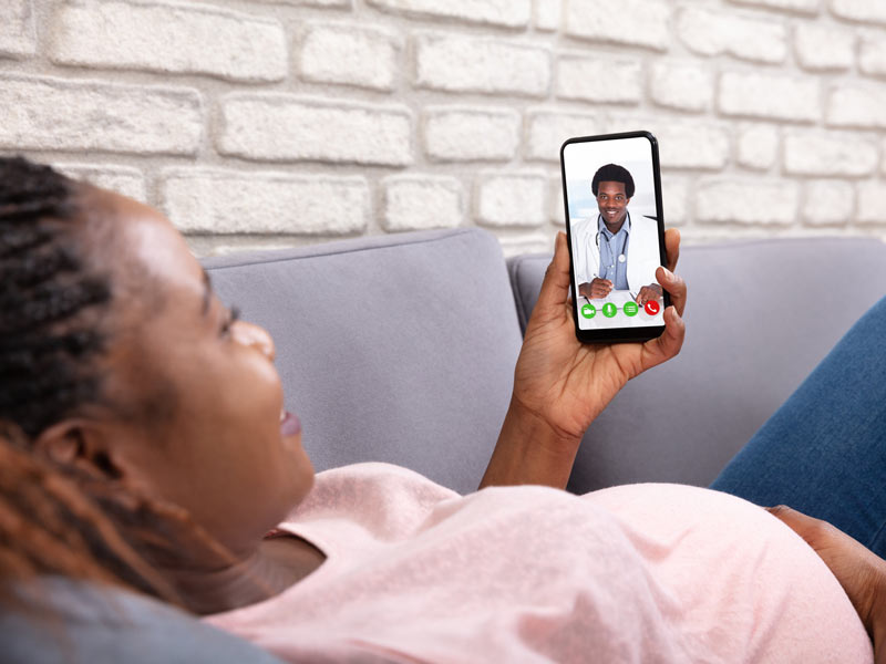 woman talking with physician on smartphone