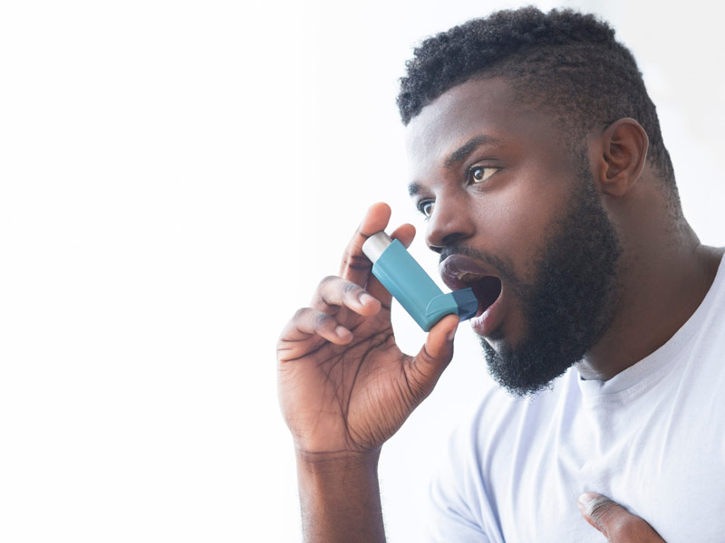young man with inhaler