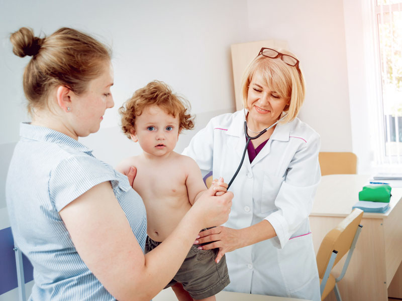 physician examining young patient