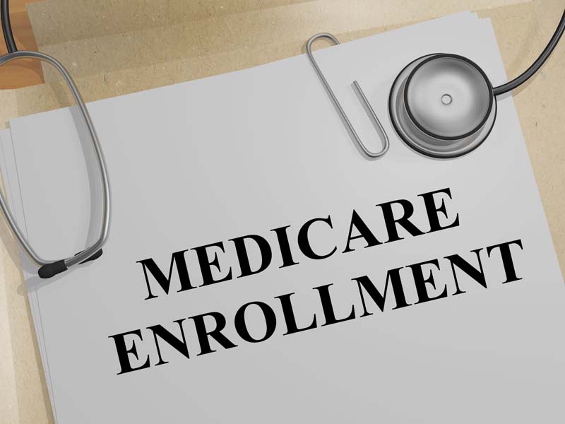 Stethoscope on a sheet of paper that says "Medicare enrollment"