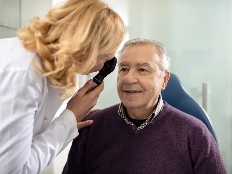 physician examining patient's eyes