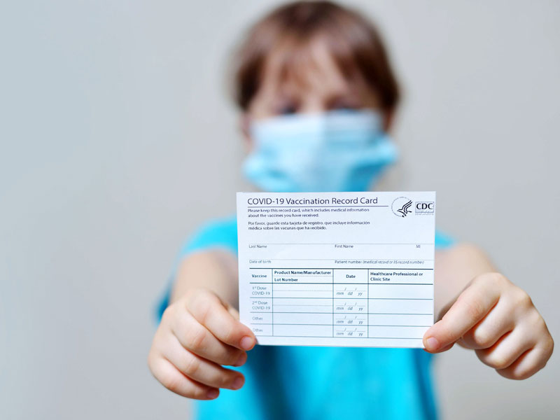 child with vaccine card