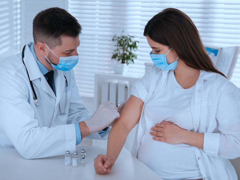 pregnant woman receiving vaccine