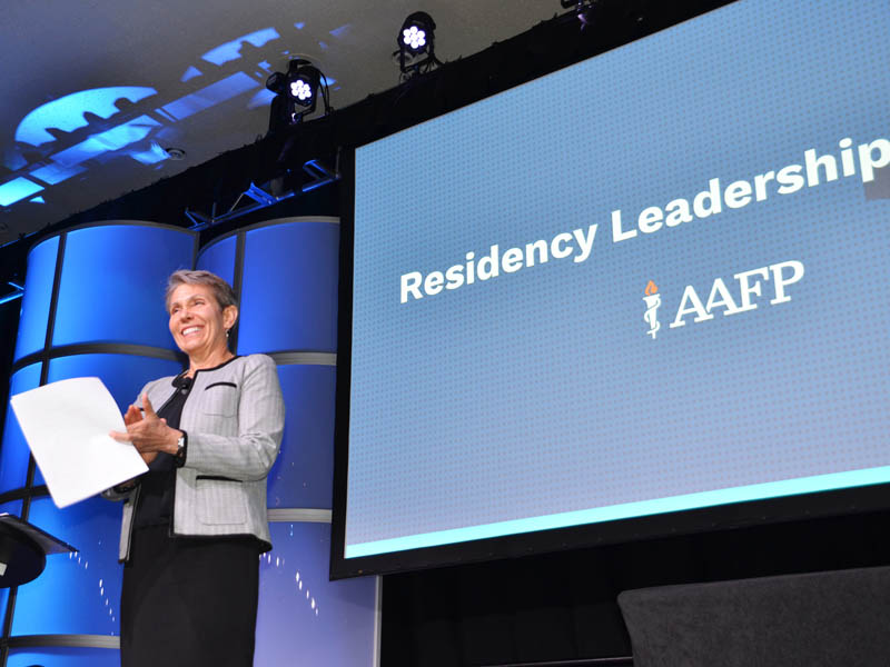 Karen Mitchell, MD, FAAFP, speaks on stage at the AAFP Residency Leadership Summit