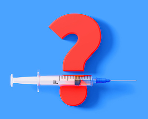 Syringe sitting over a huge red question mark on blue background, Horizontal composition with copy space. Great use for concepts related to warnings and side effects of vaccines.
